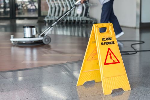 Service/woman-worker-cleaning-floor-with-polishing-machine.jpg